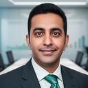 Finance leader portrait in a modern boardroom with reports spread across a table